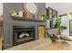 Elegant living room featuring fireplace, wood storage and stylish decor at 4067 Randall Farm Se Rd, Atlanta, GA 30339