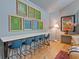 Open living area featuring a modern table with bar seating, stylish decor, and hardwood flooring at 4067 Randall Farm Se Rd, Atlanta, GA 30339