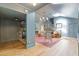 Spacious living room area leads to a reading nook, featuring an open staircase and a sunlit atmosphere at 4067 Randall Farm Se Rd, Atlanta, GA 30339