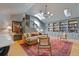 Inviting living room boasting a skylight, cozy seating, hardwood floors, and custom built-in bookshelves at 4067 Randall Farm Se Rd, Atlanta, GA 30339