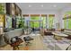 Modern living room features hardwood floors, gallery wall, and glass doors to the outdoor patio at 4067 Randall Farm Se Rd, Atlanta, GA 30339