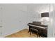 Cozy piano room with a piano, artwork, and hardwood floors at 4067 Randall Farm Se Rd, Atlanta, GA 30339