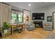 Main bedroom sitting area with fireplace, hardwood floors, and comfortable seating at 4067 Randall Farm Se Rd, Atlanta, GA 30339