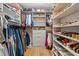 Custom walk-in closet with ample storage, including shelves and hanging space for clothes and shoes at 4067 Randall Farm Se Rd, Atlanta, GA 30339