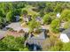 Aerial neighborhood view showing community homes situated near a picturesque lake at 823 Langley View Ct, Loganville, GA 30052