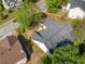 Aerial view of cozy home showing the dark roof and proximity to a quiet neighborhood street at 823 Langley View Ct, Loganville, GA 30052