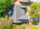 Birds eye view of home with dark roof surrounded by lush trees with a well-maintained yard at 823 Langley View Ct, Loganville, GA 30052