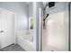 Bright bathroom featuring a soaking tub next to the shower stall with rain shower head at 823 Langley View Ct, Loganville, GA 30052