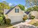 Attractive home with a two-car garage, manicured shrubs, and a well-maintained lawn at 823 Langley View Ct, Loganville, GA 30052