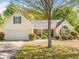 Charming single-story home with a well-manicured lawn, attached garage, and welcoming front entrance at 823 Langley View Ct, Loganville, GA 30052