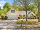 Charming single-Gathering home with a well-manicured lawn and attached two-car garage at 823 Langley View Ct, Loganville, GA 30052