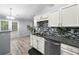 Kitchen with stainless steel appliances and granite countertops, with breakfast nook in view at 823 Langley View Ct, Loganville, GA 30052