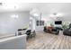 Spacious open-concept living area with modern flooring, dining space, and comfortable seating at 823 Langley View Ct, Loganville, GA 30052