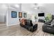 Cozy living area featuring modern decor, including stylish seating and wall art at 823 Langley View Ct, Loganville, GA 30052