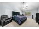 Spacious main bedroom with chair and vaulted ceiling at 823 Langley View Ct, Loganville, GA 30052