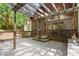 Expansive wooden back deck with a screened-in porch, ideal for outdoor living at 11060 Pennbrooke Xing, Johns Creek, GA 30097