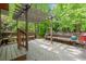 Wooden deck with pergola and built-in seating offers a relaxing outdoor space at 11060 Pennbrooke Xing, Johns Creek, GA 30097