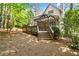 Backyard with deck, screen porch, and beautiful mature trees at 11060 Pennbrooke Xing, Johns Creek, GA 30097