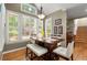 Bright breakfast nook features natural light, hardwood floors, and a modern light fixture at 11060 Pennbrooke Xing, Johns Creek, GA 30097