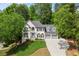 Charming two-story home with well-maintained landscaping and a three-car garage at 11060 Pennbrooke Xing, Johns Creek, GA 30097