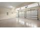Spacious three-car garage with a door leading to the outside at 11060 Pennbrooke Xing, Johns Creek, GA 30097