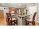 Kitchen island with four chairs, granite countertops, and stainless steel appliances at 11060 Pennbrooke Xing, Johns Creek, GA 30097