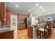 Spacious kitchen with stainless steel appliances, granite countertops, and wood cabinetry at 11060 Pennbrooke Xing, Johns Creek, GA 30097