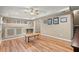 Large living room with laminate flooring, natural light, and a bar area at 11060 Pennbrooke Xing, Johns Creek, GA 30097