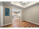 Cozy living area with hardwood floors leading into another room with white molding at 11060 Pennbrooke Xing, Johns Creek, GA 30097