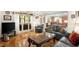 Spacious living room boasts natural light, hardwood floors, and comfortable seating at 11060 Pennbrooke Xing, Johns Creek, GA 30097