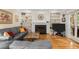 Inviting living room with custom built-ins, a fireplace, and hardwood floors at 11060 Pennbrooke Xing, Johns Creek, GA 30097