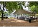 Charming picnic area with multiple tables next to the pool making it an ideal spot for outdoor entertaining and relaxation at 11060 Pennbrooke Xing, Johns Creek, GA 30097