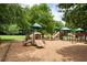 Charming playground featuring slides and climbing structures enhancing a Gathering-friendly atmosphere in a lush, green setting at 11060 Pennbrooke Xing, Johns Creek, GA 30097
