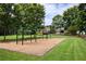 Classic swing set on a wood chip base near a wide expanse of lawn creating an inviting and fun neighborhood play area at 11060 Pennbrooke Xing, Johns Creek, GA 30097