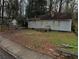 Modest single-story home with boarded windows, awaiting restoration and transformation at 1254 Campbellton Sw Rd, Atlanta, GA 30310