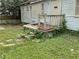 Exterior view shows overgrown porch with vegetation growing over the steps at 1254 Campbellton Sw Rd, Atlanta, GA 30310