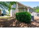 View of a landscaped backyard with green bushes and trees at 1396 Dolcetto Nw Trce # 12, Kennesaw, GA 30152