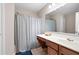 Bathroom features a vanity with solid surface countertop and tub and shower with tile surround at 1396 Dolcetto Nw Trce # 12, Kennesaw, GA 30152