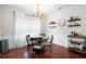 Dining area with hardwood floors, a chandelier, and stylish decor at 1396 Dolcetto Nw Trce # 12, Kennesaw, GA 30152