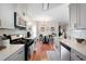 Bright, updated kitchen includes stainless appliances, subway tile backsplash, and dining area at 1396 Dolcetto Nw Trce # 12, Kennesaw, GA 30152