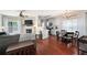 Open-concept living room featuring hardwood floors, fireplace, and a dining area at 1396 Dolcetto Nw Trce # 12, Kennesaw, GA 30152
