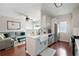 Open-concept living room and kitchen boasts hardwood floors and ample natural light at 1396 Dolcetto Nw Trce # 12, Kennesaw, GA 30152