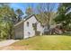 Well-kept home featuring a spacious backyard with lush greenery, offering ample room for outdoor enjoyment at 257 Browning Cir, Acworth, GA 30101