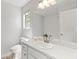 White bathroom featuring a sink and a mirror with a window at 257 Browning Cir, Acworth, GA 30101
