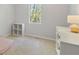 Bedroom with neutral walls, carpet, and window with natural light at 257 Browning Cir, Acworth, GA 30101