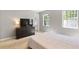 This bedroom has neutral colored walls, carpet and a view of the bathroom at 257 Browning Cir, Acworth, GA 30101