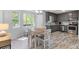 Bright dining area with hardwood floors, modern table, and views of the outdoor scenery at 257 Browning Cir, Acworth, GA 30101