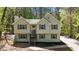 Charming home with light siding, green shutters, and a neatly landscaped front yard with mature trees at 257 Browning Cir, Acworth, GA 30101