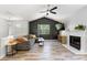 Inviting living room with hardwood floors, fireplace, comfortable seating, and vaulted ceiling at 257 Browning Cir, Acworth, GA 30101