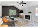 Comfortable living room featuring hardwood floors, a fireplace, and a vaulted ceiling at 257 Browning Cir, Acworth, GA 30101